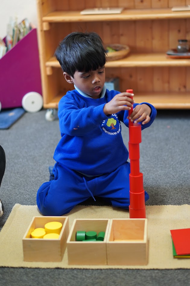 Children learning through Montessori activities at Little Elms